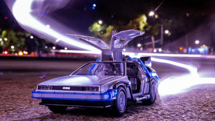 a toy car with its hood open sitting on the ground
